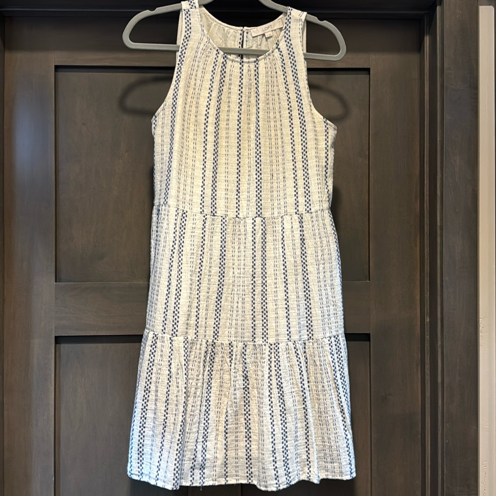 Tiered dress, sleeveless.